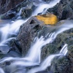 Small waterfall and reflections