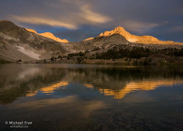 Sunrise illuminates North Peak Sunrise illuminates North Peak. I like the rippled reflection, preserved by a fast shutter speed (1/90th sec)