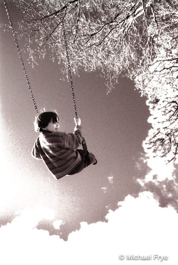 My son Kevin on a swing at age three