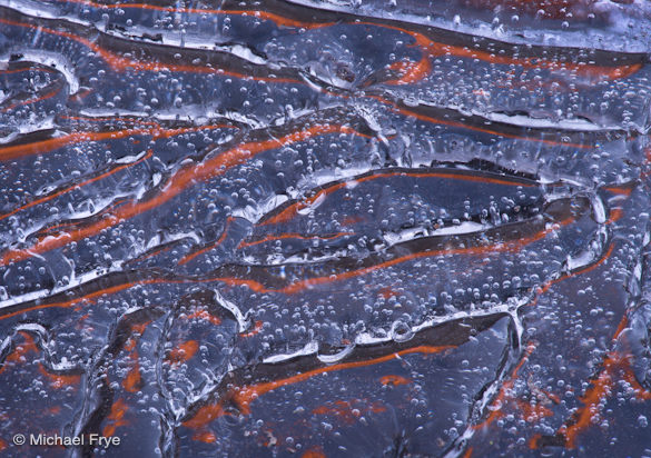 Ice with reflections of cliffs at sunset, Yosemite