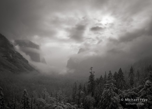 Sun breaking through mist after a spring snowstorm, Tunnel View, Yosemite NP, CA, USA