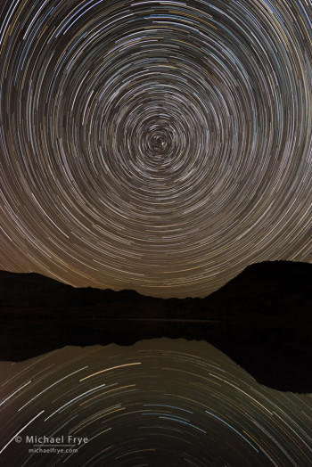Star trails reflected in an alpine lake, Yosemite NP, CA, USA. Nikon D800E with 17-35mm f/2.8 lens; sequence of 24 exposures totaling about 96 minutes; each exposure 4 minutes at f/5.6, 400 ISO