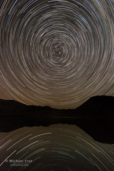 Star trails reflected in an alpine lake, Yosemite NP, CA, USA. Nikon D800e with 17-35mm f/2.8 lens; sequence of 24 exposures totaling about 96 minutes; each exposure 4 minutes at f/5.6, 400 ISO