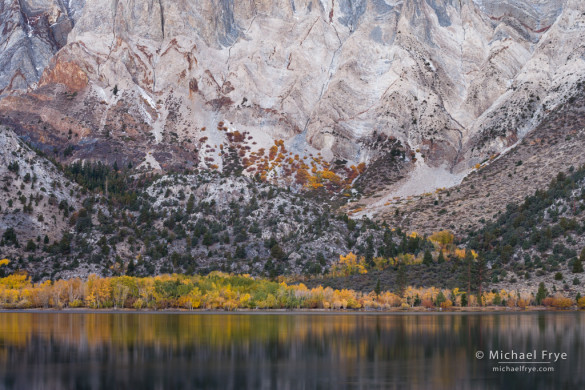 Rock formations and autumn color along the base of Laurel Mountain from Convict Lake, Inyo NF, CA, USA