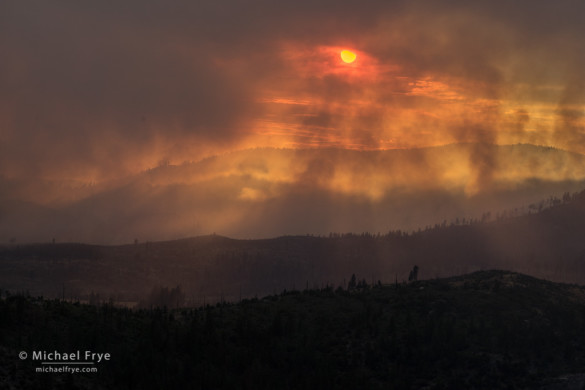 Sun setting through smoke from the El Portal Fire, 7/28/14, Yosemite NP and Stanislaus NF, CA, USA