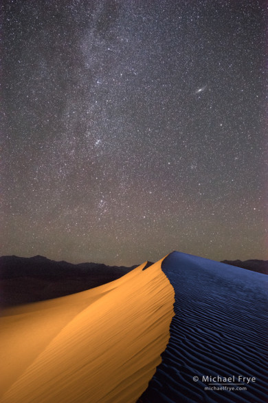 Milky Way and Andromeda Galaxy over sand dunes, Death Valley NP, CA, USA (light-painted)