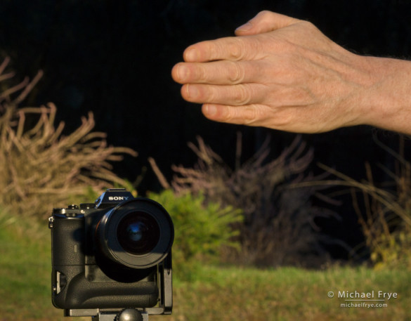 Bring the shadow of your hand down until it just barely covers the front glass