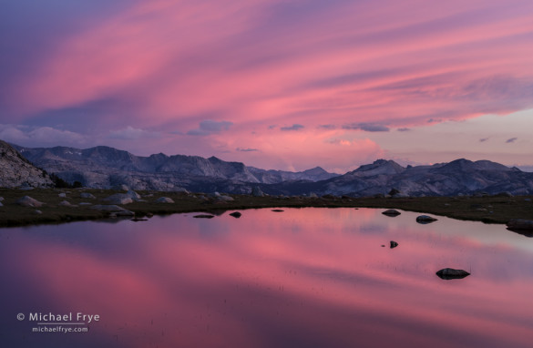 Sunset clouds reflected in an alpine tarn, Yosemite NP, CA, USA