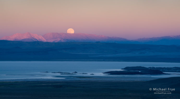 Moon rising above Mono Lake and the White Mountains at sunset, CA, USA