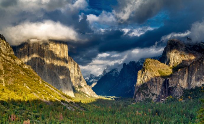 Here's I've cropped most of the expanse of trees on the bottom, plus a little off the left side. To me this is the best crop for this photograph, though I'd prefer to see even more clouds above.