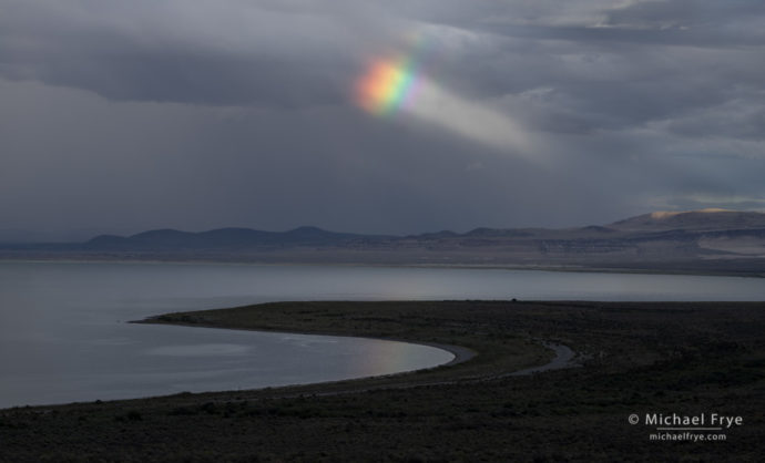 Rainbow and sunbeam over Mono Lake, CA, USA