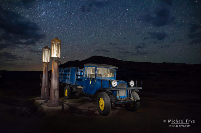 1927 Dodge Graham with gas pumps at night, Bodie State Historic Park, CA, USA