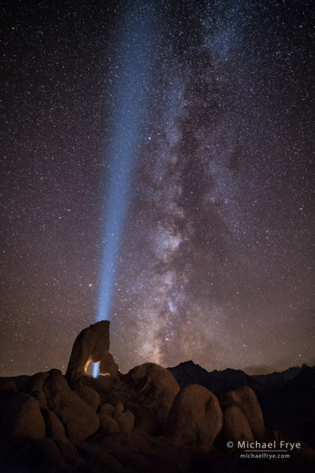 Light beam, Milky Way, and arch, Alabama Hills, CA, USA