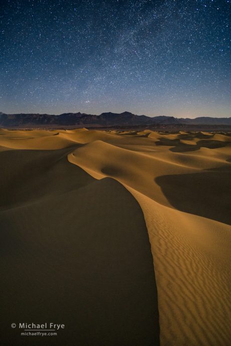 Moonlight on sand dunes underneath the Milky Way, Death Valley NP, CA, USA