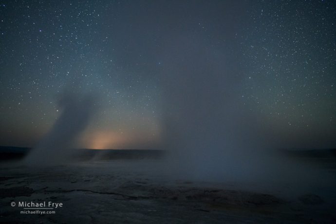 Fountain and Clepsydra Geysers erupting at night, Yellowstone NP, WY, USA