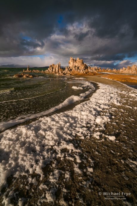 Foam lining the shore of Mono Lake on a stormy afternoon, CA, USA