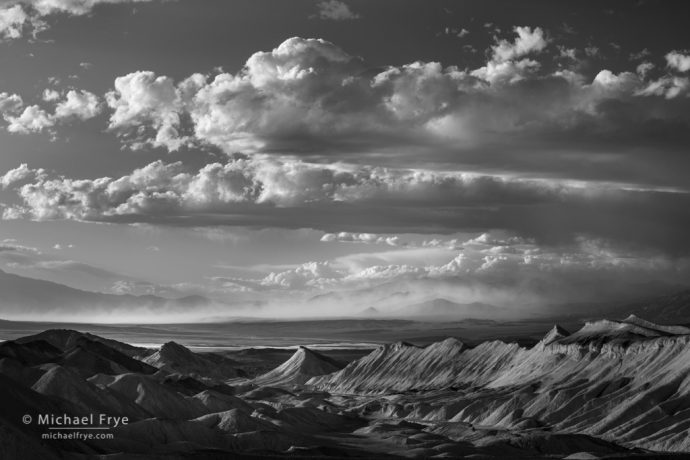 Badlands and a distant sandstorm, Death Valley NP, CA, USA