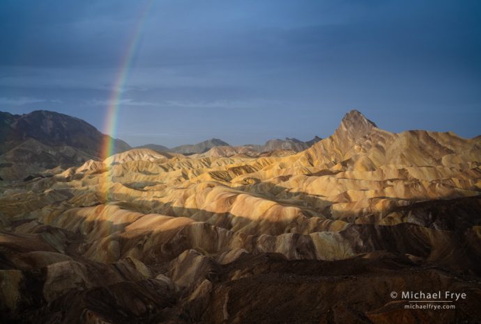 Rainbow over badlands, Death Valley NP, CA, USA