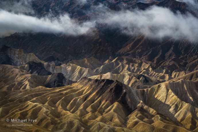 Mist over badlands, Death Valley NP, CA, USA