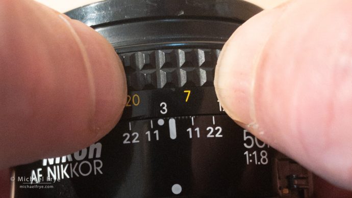 Instead of using foot or meter marks on the lens, you can just mark the closest and furthest points with your fingernails.