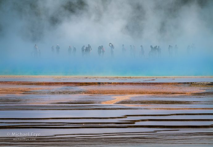 People in the blue mist, Grand Prismatic Spring, Yellowstone NP, WY, USA