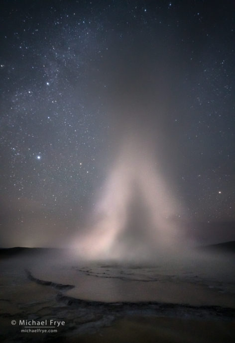 22. Geyser erupting at night, Yellowstone NP, WY, USA