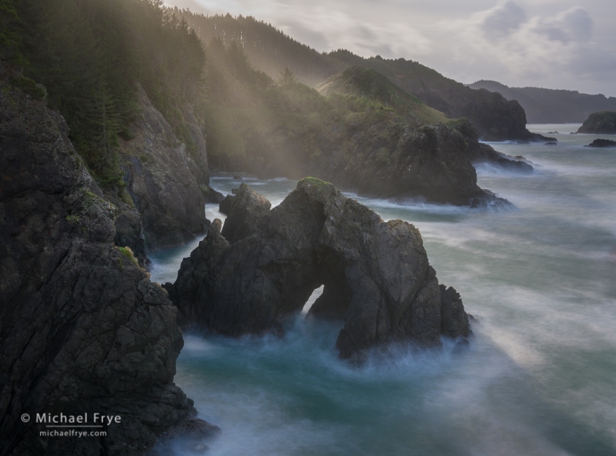 Sunbeams and natural bridge, Oregon Coast, USA