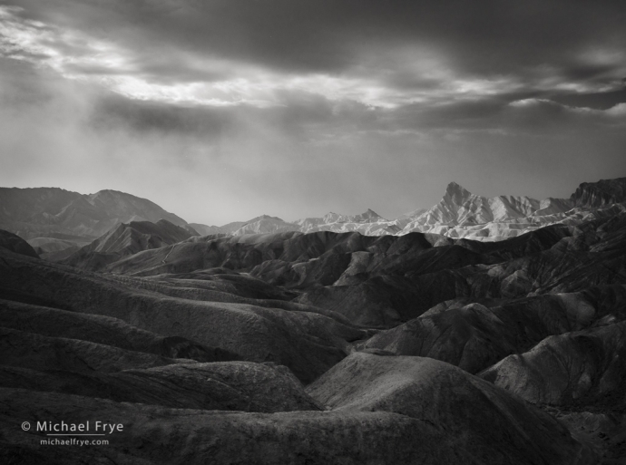 Badlands and Manly Beacon during a dust storm, Death Valley NP, CA, USA