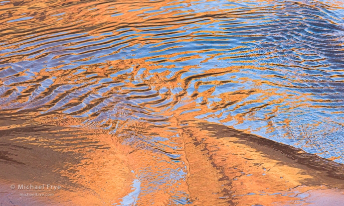 Reflections on the edge of the Colorado River, Grand Canyon NP, AZ, USA