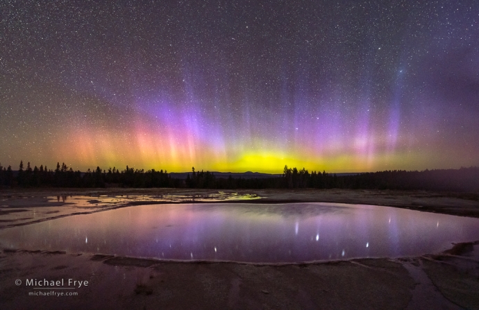 Aurora borealis reflected in a thermal pool, Yellowstone NP, WY, USA