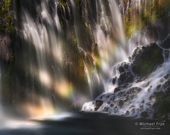 Tree shadows, rainbow, and waterfall, California, USA