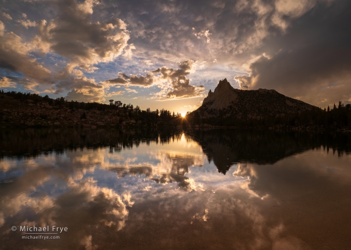 Sun setting over an alpine lake, Yosemite NP, CA, USA