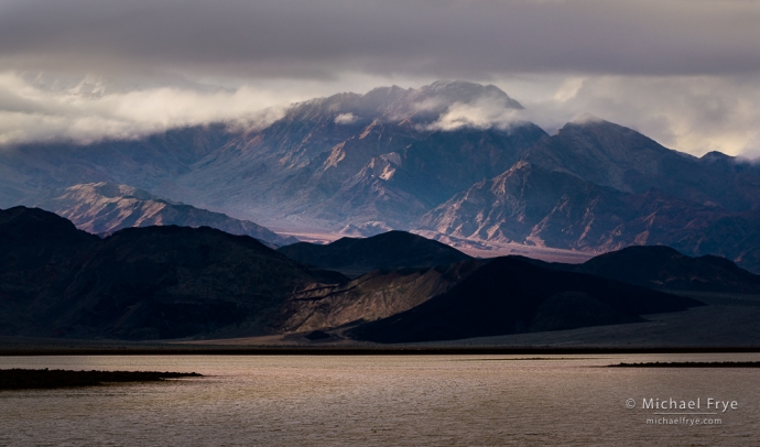 Peak and clouds above salt flats, Death Valley NP, CA, USA