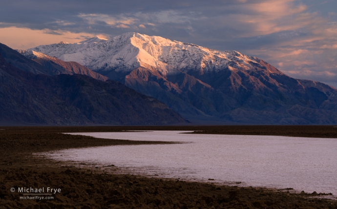 Snowy mountain above salt flats, Death Valley NP, CA, USA