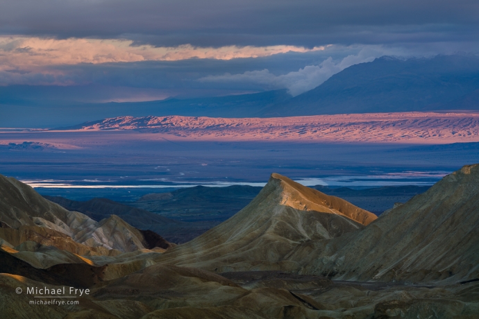 Badlands, clouds, and distant salt flats, Death Valley NP, CA, USA
