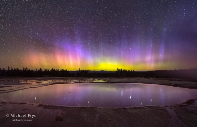 Aurora borealis reflected in a thermal pool, Yellowstone NP, WY, USA