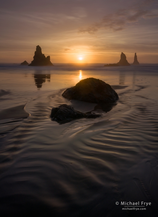 Rocks and setting sun, Oregon Coast, USA