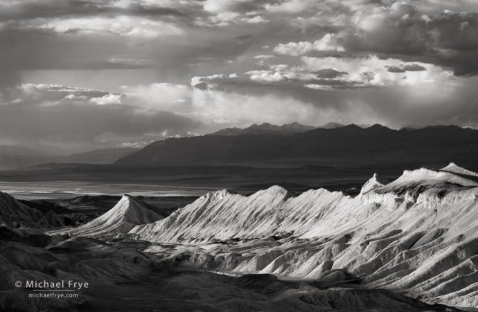 Badlands, clouds, and mountains, Death Valley NP, CA, USA