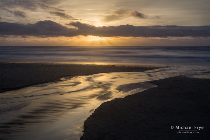 Ocean and creek at sunset, Monterey Peninsula, CA, USA