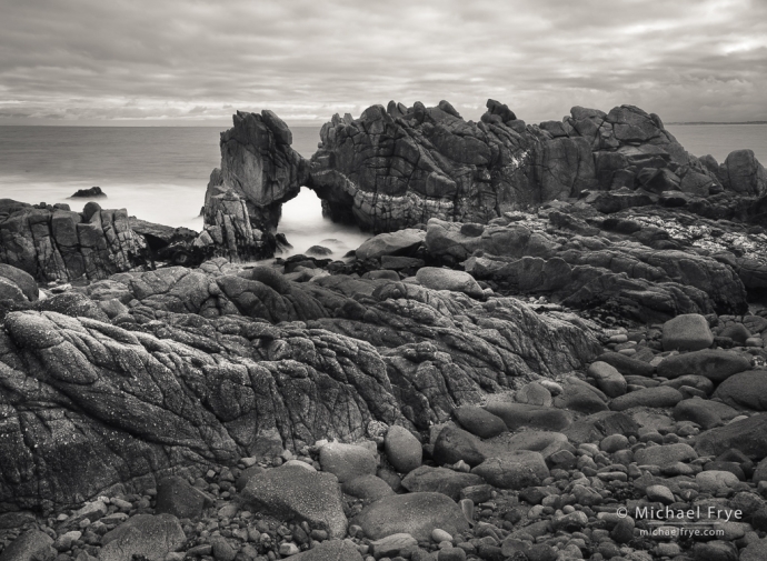Arch, rocks, and clouds, Monterey Peninsula, CA, USA