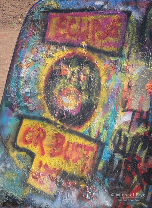 Spray-painted graffiti at the Cadillac Ranch near Amarillo, TX, USA