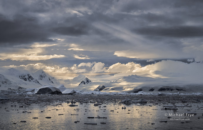 Clouds, sunbeams, and mountains, Antarctica