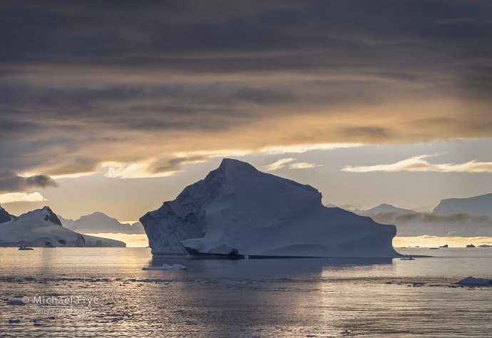 Iceberg, clouds, and a distant fog bank, Antarctica