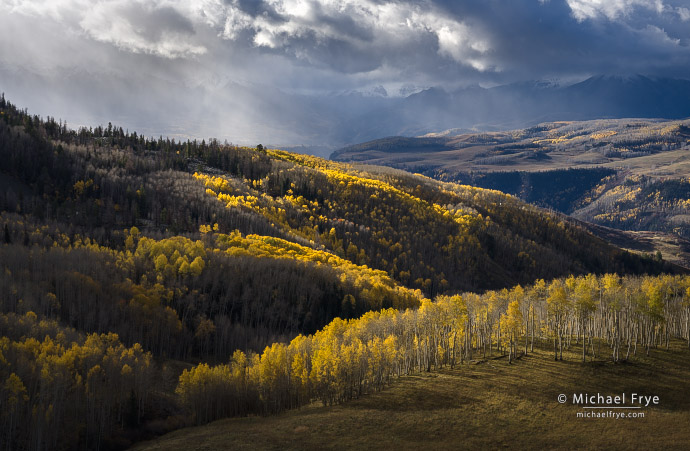 39. Clouds, sunbeams, and aspens in autumn, CO, USA