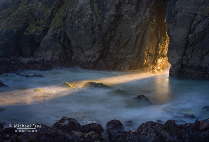 47. Shaft of light through a natural bridge, Oregon Coast, USA
