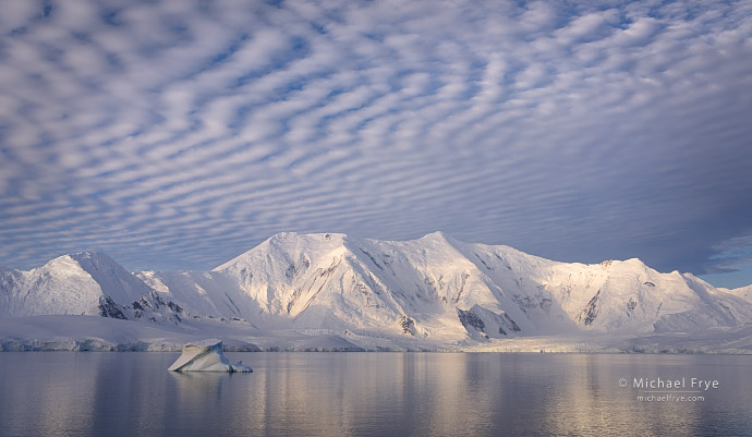 Ice-covered mountains under a mackerel sky, Antarctica