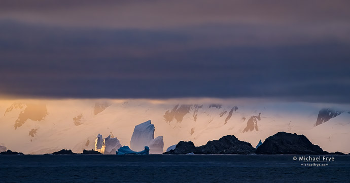 Rocks and icebergs at sunset, Antarctica