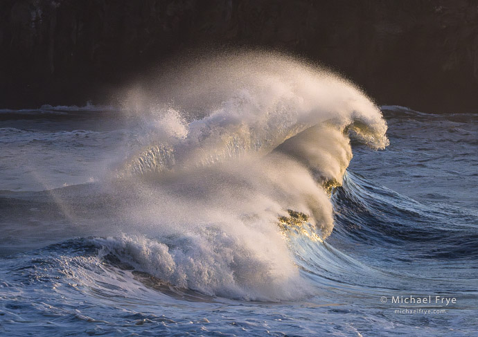 Wave splash at sunset, northern California coast, USA